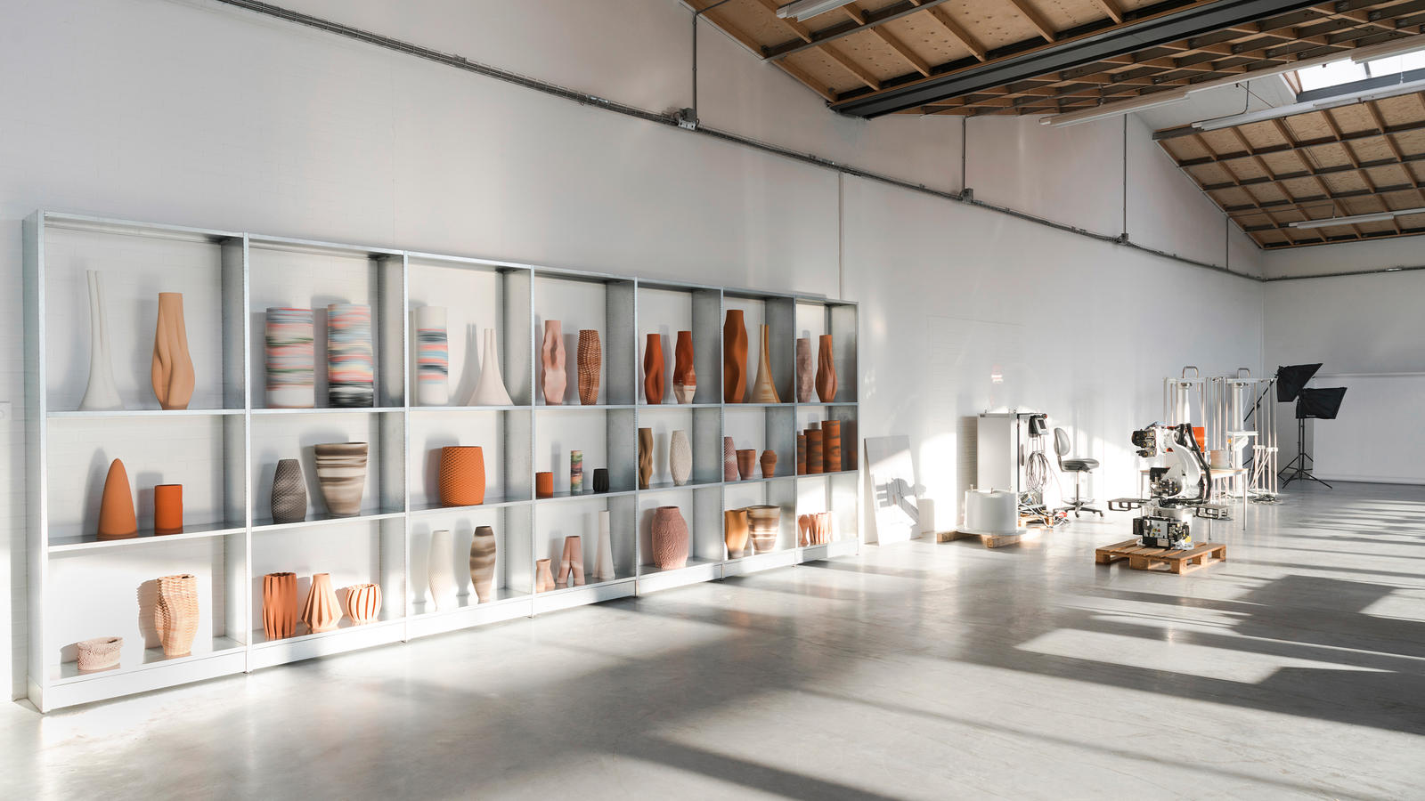 Olivier van Herpt's studio with ceramic works and 3D printers